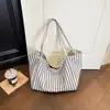 Bolso tote de rayas de alta gama japonés y coreano transfronterizo para mujer, nuevo bolso versátil para hombro y axila 2026, bolso de mano de gran capacidad