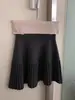 Nuevo falda plisada versátil de cintura elástica de alta gama en línea A para mujer, falda midi de punto adelgazante de cintura alta para primavera y otoño en línea A