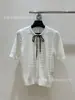 Conjunto de Top de Punto Trenzado de Manga Corta con Cuello Redondo Estilo Universitario Mariposa + Falda Casual de Marca de Comercio Exterior Original Lv