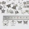 Ventas directas de fábrica plata antigua accesorios de plata Xizang accesorios de pulsera accesorios diy 60 piezas traje de aleación de mariposa pequeña de plata antigua