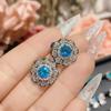 Pendientes de flor de zafiro suizo brillantes de lujo nuevo Camelia chapados en oro de 18 quilates pendientes de diseño de joyería de alta gama para mujer