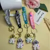 Llavero de astronauta de dibujos animados transfronterizo, fresco y moderno, colgante para pareja, figura, accesorio para mochila y coche, pequeño regalo