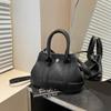 Comercio exterior este año explosiones populares bolso pequeño para mujer 2025 nuevo bolso bandolera versátil moda súper fuego bolso de cubo portátil