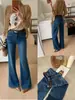 TOP de Outono estilo Europeu Guangzhou Treze Linhas Calça de supermodelo francesa, jeans flare com stretch perfeito com cinto 61858