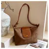 Bolso de hombro nuevo, moderno y elegante para mujer, una opción popular para el uso diario, con gran capacidad y un diseño retro de gamuza