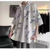 Verão Ins Design Sense Impresso Camisa de manga curta Moda Masculina Estilo Coreano Na moda plus size Camisa de meia manga solta Roupas