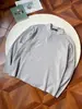 2026 Primavera/Outono Novo Top de Cor Sólida com Meio Botão e Manga Longa Primavera/Outono Gola Henley Canelada Solto e Emagrecedor
