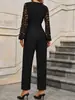 Mono de encaje negro europeo y americano con empalmes para mujer, cuello en V, efecto adelgazante en la cintura, con cortes, manga larga, mono decorativo con cadena metálica