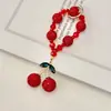 Colgante de llavero de cereza de diamantes completos transfronterizo, bola de diamante de arcilla, cadena de cuentas de cristal, charm de bolsa de cereza incrustado de diamantes, cadena para teléfono
