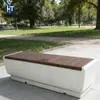 El banco largo estándar de cemento GRC se puede personalizar con chapa de madera o terrazo para asientos en paisajes exteriores