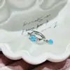 Nueva colección de serie de proteína azul de pendientes de acero de titanio médico, elegantes y versátiles, con diseños de trébol de cuatro hojas y cruz