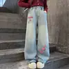 Calça Jeans Feminina 2026 Nova Calça de Barra Reta Meninas Outono Inverno Moda Estilo Quente Versátil Bordado de Toalha Coração Calça de Barra Larga