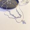 Cadena de clavícula con diseño de nicho de verano para mujer, con costuras de circonitas de estrella de cuatro aristas y aceite de gota azul apilado de doble capa.
