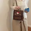 Mochila nicho fresco caricatura 2026 mochila para ir al trabajo nuevo estilo femenina lindo estilo pequeño versión coreana escolar estampado de leopardo moda