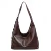 Colección de otoño 2026 transfronteriza: bolso bandolera retro de estilo nicho para mujer, versátil bolso con forma de dumpling, bolso de hombro moderno y práctico para ir al trabajo