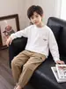 Camiseta infantil raglan de manga comprida estampada 2026 novo estilo outono meninos cor sólida solta base para crianças mais velhas