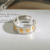 Jingqiao design amor cor ouro 18K aço inoxidável combinação de cores ouro e prata vento maré líquida rebite padrão amor anel