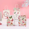 Bolsa de papel Kraft con impresión de mariposas transfronteriza, bolso de mano de jardín misterioso, bolso de regalo de moda para cumpleaños
