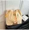 Bolsa de Lona Xadrez Transfronteiriça para Mulheres, Grande Capacidade, Nova Bolsa de Ombro Versátil com Cordão para o Verão de 2026, Bolsa Tote para Estudante Universitário