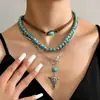 Venta Caliente Transfronteriza Nuevo Estilo Collar Apilado para Mujer Estilo Occidental Cactus Sombrero de Cabeza de Toro Cadena para el Cuello de Franela Turquesa en stock