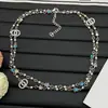 Nuevo Modelo 2025 Estilo Chanel Colorido Estrella Doble C Perla Collar Largo para Mujer, Réplica Completa de Diamante, Cadena Ligera de Lujo para Suéter Venta al por Mayor