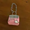 Bolsa de cuero remachada a mano con colgante de cuero plateado 2025 nuevo bolso de saturno plateado de alta gama colgante de polvo para bolso llavero