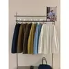 SUSAN nueva llegada principios de otoño estilo coreano diseño simple plisado versátil holgado cubre imperfecciones muestra delgado color liso falda midi TW1102