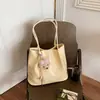 Bolsa feminina com padrão trançado da moda 2026 novo modelo simples de grande capacidade bolsa de ombro casual sensação relaxada bolsa de mão bolsa tote