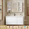 Tocador de baño engrosado y ahorrador de espacio con diseño en color crema, que cuenta con un lavabo redondeado, lavabo cerámico integrado y un lavabo de una sola pieza.