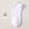 Meias para Homens e Mulheres Cano Longo Cor Sólida Desodorante Absorvente de Suor Respirável Esportivas Basquete Meias Masculinas Primavera e Outono Esportivas de Algodão Atacado