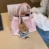 Bolso Cubo de Mano de Alta Gama Estilo Coreano Transfronterizo para Mujer 2026 Nueva Moda Versátil Textura de Alta Calidad Bolso de Hombro Cruzado
