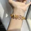 Belleza Dorada Amarillo Natural Cristal de Torre Cristal Blanco Diseño de Nicho Simple Pulsera de Gama Alta Moda Casual Versátil