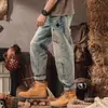 Jeans de hombre de primavera estilo coreano modernos ajustados rotos deportivos pantalones largos para hombre versátiles elásticos ajustados
