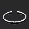 2023 Pulsera tejida retorcida abierta retro europea y americana Pulsera chapada en cobre y plata Pulsera geométrica para hombre venta al por mayor
