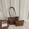 Bolsa de ombro simples transfronteiriça vazada tecida bolsa mãe-filho bolsa de ombro única casual personalizada comércio exterior tendência estilosa bolsa de axila