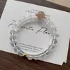 Pulsera de Cristal Blanco Natural con Oro Negro Ultra-Simple de Perlas Redondas de un Solo Círculo para Mujer, Joyería de Nicho Versátil y Elegante