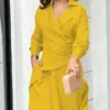 Roupas femininas de comércio exterior europeu e americano para o outono de 2026, novo estilo, vestido de cor sólida com decote V, acinturado e fenda, moderno e elegante