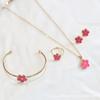 CDD doble cara nuevo flor de ciruelo juego de cuatro piezas collar aretes pulsera anillo aretes traje suministro comercio exterior