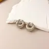 Pendientes Redondos Geométricos de Flor de Aguja Plateada Transfronterizos Europeos y Americanos Pendientes de Nicho de Gama Alta Pendientes de Moda Estilo Simple Minimalista
