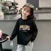 Camiseta de manga larga de algodón 100% para niñas con estampado de dibujos animados para primavera y otoño, adecuada para niños mayores y pequeños, camiseta básica versátil de cuello redondo estilo coreano