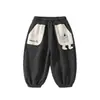 Pantalones Deportivos Bordados de Oso de Dibujos Animados Nuevos para Niños de Primavera y Otoño, Bloques de Color Bolsillos Grandes, Pantalones Largos Versátiles, Ropa para Niños Anyang