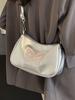 La popular bolsa baguette de este año 2024 verano bolso bandolera de nicho de alta gama para mujer estilo extranjero todo-partido bolso de hombro