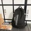 Mochila casual versátil de moda con estampado de letras de alta gama para viajes y portátil