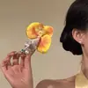 Pinza para el pelo de flor Phalaenopsis estilo vacación de verano en la playa 2026 nuevo clip lateral para ambiente de foto accesorio para recogido