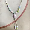 Collar con colgante de campana de mariposa de cerámica de estilo étnico retro para mujer, diseño nuevo y moderno, cadena larga para suéter, accesorios