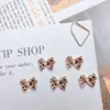 Accesorios populares para arte de uñas con lazo de estampado de leopardo estilo chica popular, tachuelas de uñas con lazo tridimensional versátiles, dulces y geniales, y decoraciones de resina