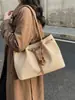 Bolso de hombro versátil de gran capacidad transfronterizo para mujer, nuevo bolso de compras casual de otoño 2026, bolso tote texturizado para el trabajo