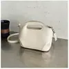 Bolso de cubo de cuero para mujer, modelo nuevo 2025, bolso de hombro de nicho de alta gama, bolso cruzado versátil vintage para el día a día