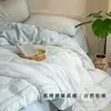 Conjunto de quatro peças estilo japonês vintage Classe A, 100% algodão, com padrão espinha de peixe, capa de edredom jacquard, lençol, roupa de cama com textura amassada branca e azul