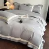 El fabricante suministra juego de cuatro piezas de bordado de aplique de algodón de fibra larga para ropa de cama de lujo ligero de alta gama para uso doméstico, incluyendo fundas de edredón y sábanas, al por mayor